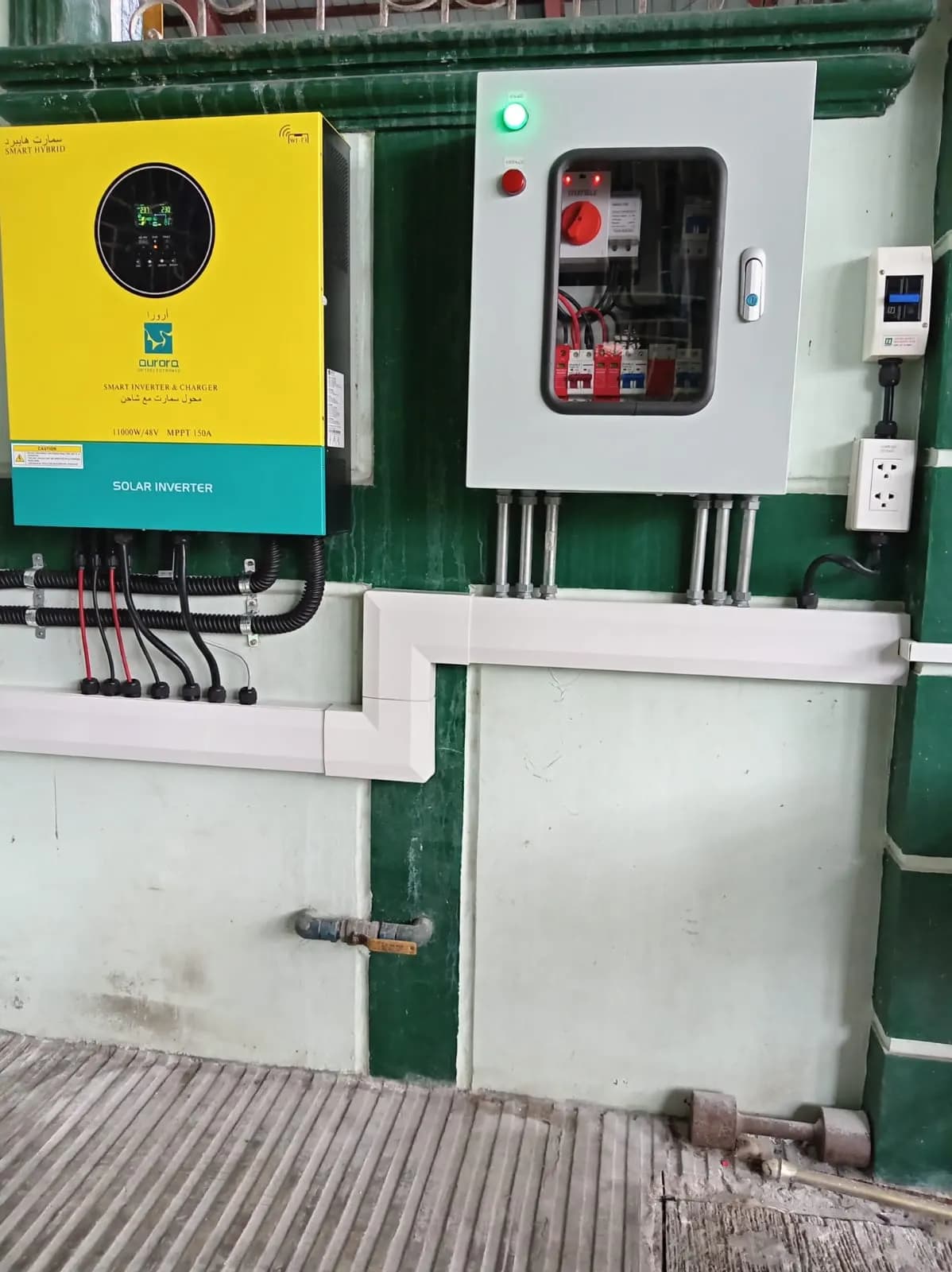 Hybrid inverter beside a distribution box with neat conduit runs