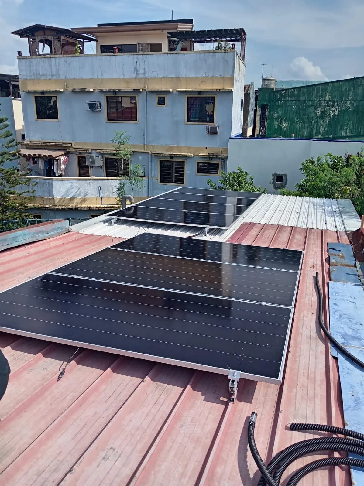 Solar panels laid out on a roof during a site survey